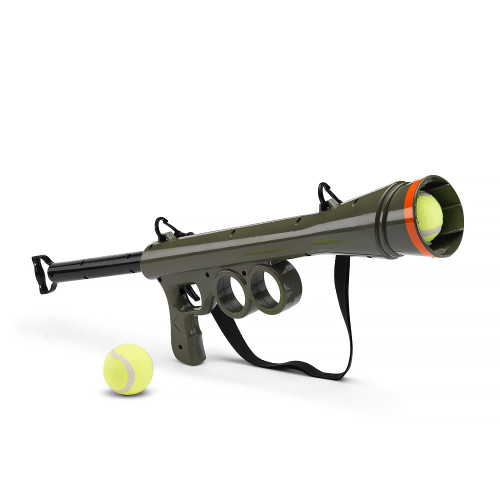 The bazooka-style Dog Ball Launcher in olive green, with a tennis ball loaded in the barrel and a spare ball sitting beside it.