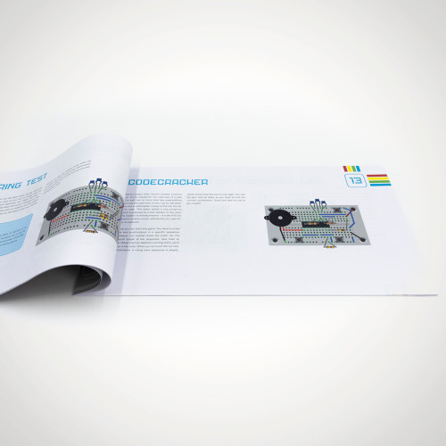 The advent calendar instruction book open, showing the 'Codecracker' electronic project on page 13.