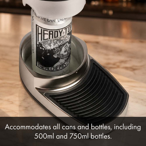 A black countertop draft beer dispenser sits on a countertop, with a can of beer being inserted into the tray. The text below details what size of bottle and cans the dispenser can fit.