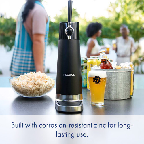 The black Fizzics DraftPour tap on a patio table with a pint, popcorn, and an ice bucket during a garden party.