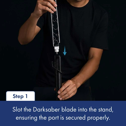 Someone shows how to use the desk light. First step is to slot the blade into the stand. Ensure the port is secured properly.