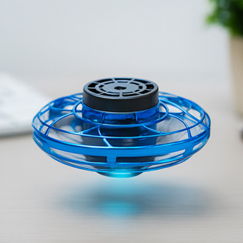 A blue LED Vortex Spinner hovers above a desk, glowing with a bright blue light from its base.