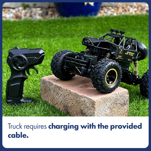 A black Rock Crawler RC truck with large tyres sits on a brick in the grass. It charges with the provided cable.