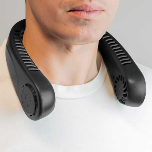 Close-up of a man wearing the black BeCool bladeless neck fan, resting on his neck and shoulders.