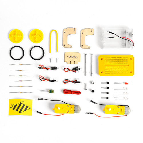 The Robot Advent Calendar parts laid out, including yellow wheels, motors, a breadboard, wooden parts, wires, and resistors.