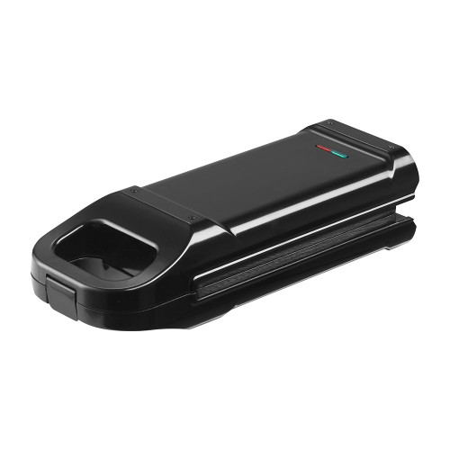 The black Treat Factory Churro Maker, closed, angled to show the handle and red and green indicator lights on top.