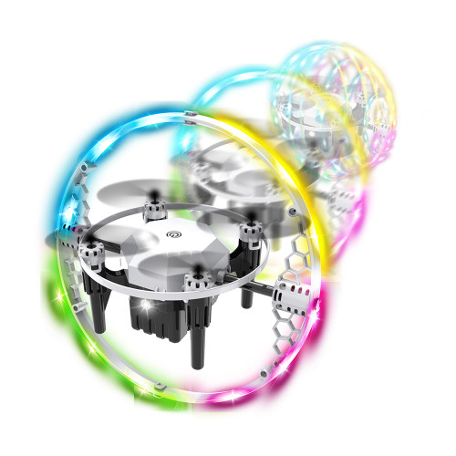 A silver Illuminator Drone inside its protective cage, glowing with a vibrant, colourful light trail suggesting fast motion.