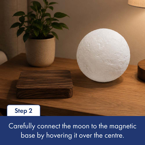 Then, carefully place the moon onto the magnetic base by hovering it over the centre.