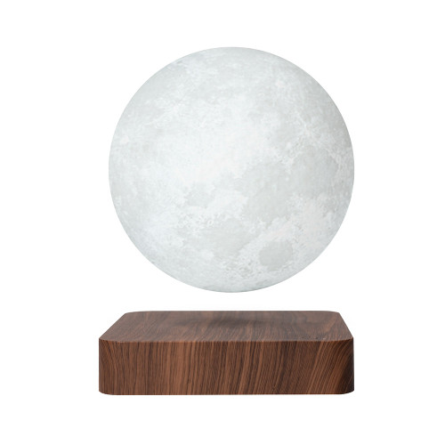 The Floating Moon, a textured grey sphere, levitates over a square base with a dark wood-grain finish.