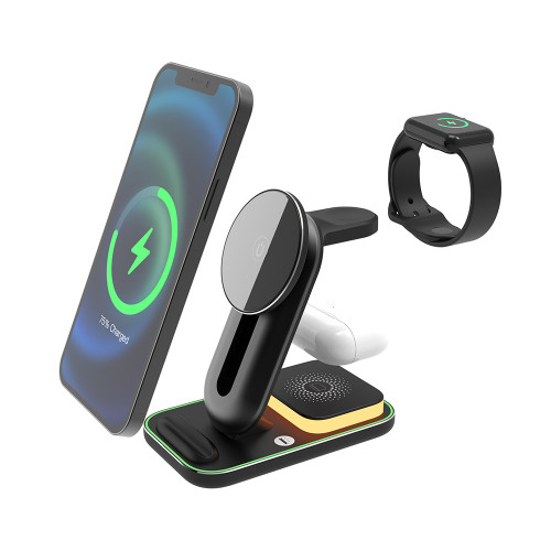 A black 3-in-1 charging station powers a smartphone, watch, and earbuds. The base is illuminated with a warm night light.