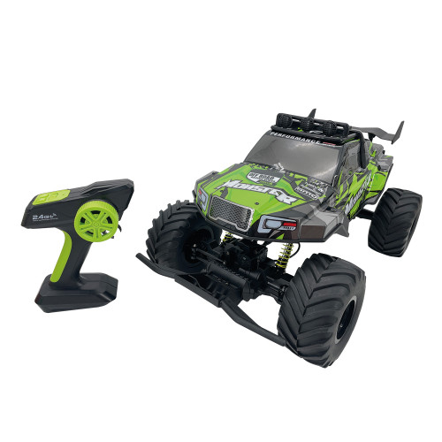 The Rock Monster RC truck, with green and black graphics and large tyres, sits beside its matching pistol-grip controller.