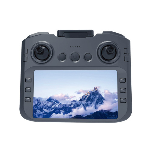 A grey FPV FX90 Drone controller with dual joysticks. Its large screen displays a crisp aerial view of a snowy mountain.