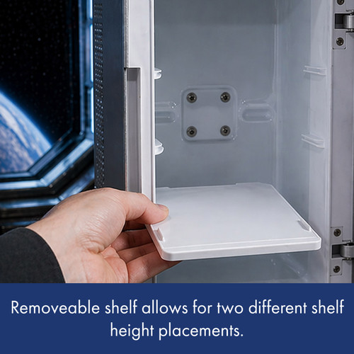 Close-up of a hand placing the removable white shelf inside the mini fridge, which has guides for two different heights.