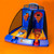 The Electronic Arcade Basketball game set up on an orange surface, showing its twin courts, hoops, and digital scoreboard.