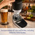 A hand lowers the DraftPour top onto a beer can, with a full pint glass alongside. It can accommodate all cans and bottles.