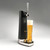 A black countertop draft beer dispenser sits on a white background with a pint of beer sitting on the tray.