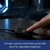 Close-up of a finger pressing the in-line power switch, which can be held down to adjust the desk light's brightness.