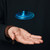 The blue LED Vortex Spinner levitates in mid-air above an outstretched hand.