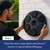 A man attaches a circular black boxing pad mounted on a wall outdoors.  Text below describes step three about how to attach it to a wall.