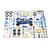 A blue vintage racer car surrounded by all the individual blue, gold, and silver components from the model kit.