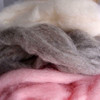 Wholesale Pink Wool Roving Fiber. What is Wool Roving Fiber? Wool roving refers to wool fiber that has been processed but not yet spun into yarn. They are mainly prepared for spinning to create yarn but they may also be used for specialized forms of felting, knitting or other textile arts. 