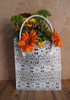 This stylish lace bag measures 10 1/2"W x 4"D x 11"H. Stands 17" tall including the vinyl covered handles. Made with stiffened lace.