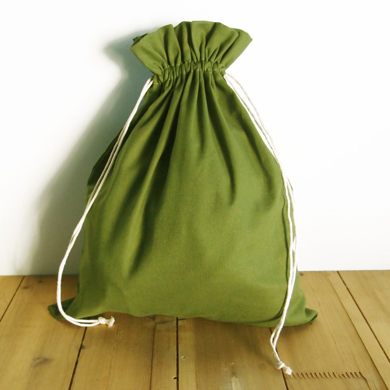 12 x 14 inches Olive Green Cotton Natural Drawstring Bag, Wholesale Cotton Drawstring Bags at Packaging Decor
B978-6-8