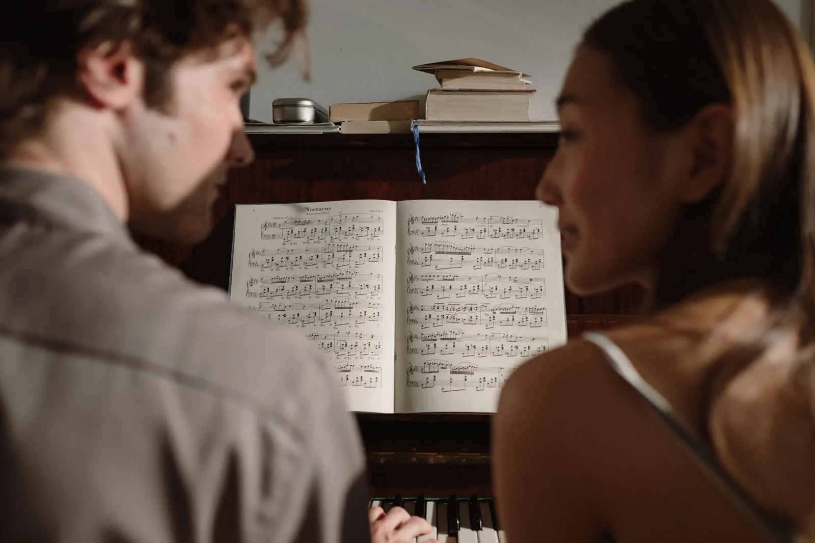 A couple enjoying music together at the piano