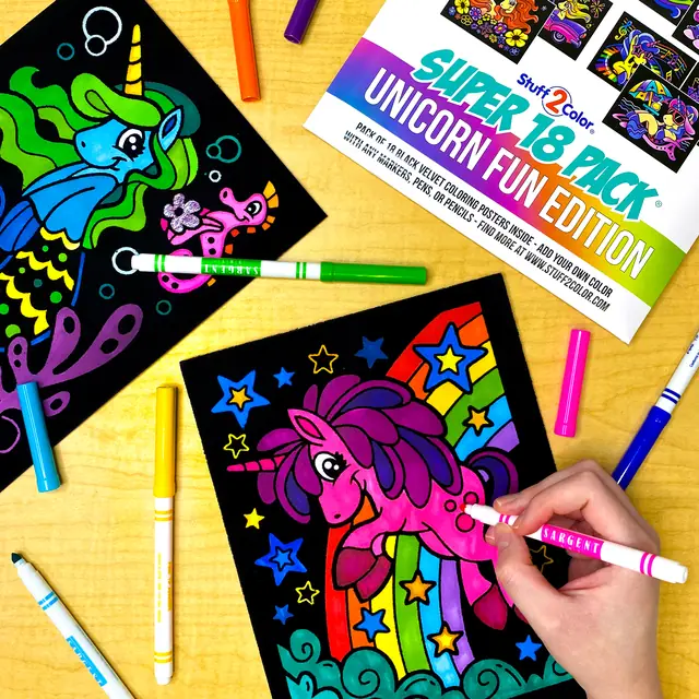 Hand coloring a fuzzy velvet unicorn coloring poster with markers, next to a Super 18 Pack