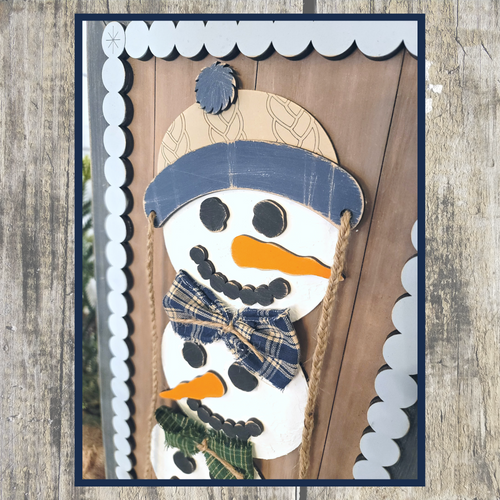 Snowman stacker leaning sign 