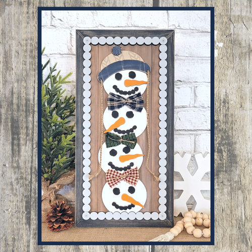 Snowman stacker leaning sign 