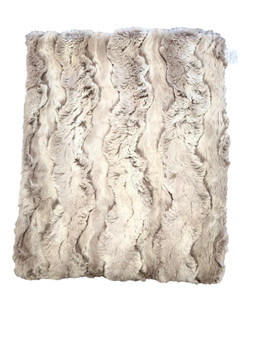 The Sandy Beach Cozy Faux fur throw brings warmth and comfort of coastal living into your home.  This ultra soft throw mimics the gentle textures of sand and surf, creating an inviting atmosphere perfect for snuggling up.