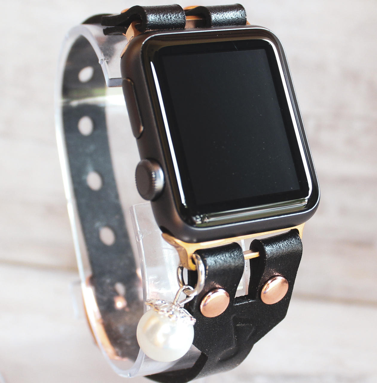 Black leather apple watch strap with musical note stamp and pearl