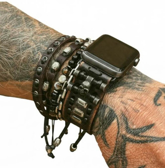 Distressed black skull leather Apple Watch band worn with stacked leather and beaded bracelets