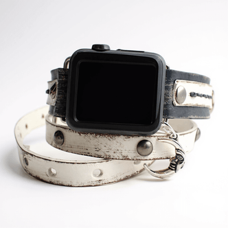 Distressed leather Apple Watch strap in white, handcrafted wraparound design with rivet details.