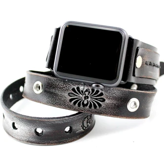 Handmade black leather Apple Watch band for ladies showing layered straps, floral patterns, and silver-tone details.
