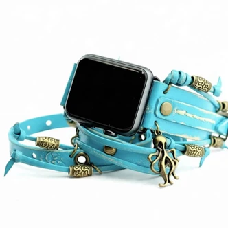 Handmade turquoise Apple Watch band for women with dangling octopus charm, leather knots, and decorative beads.