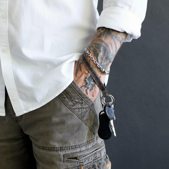 Custom leather wristlet with engraved phrase and key ring