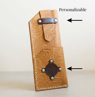 Full grain leather eyeglass case with pressed pattern and top strap closure