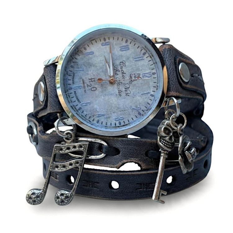 Front close-up of one-of-a-kind women's leather wrap watch with custom 37mm Cuckoo Nest dial, silver-tone case, music note and skull-key charms