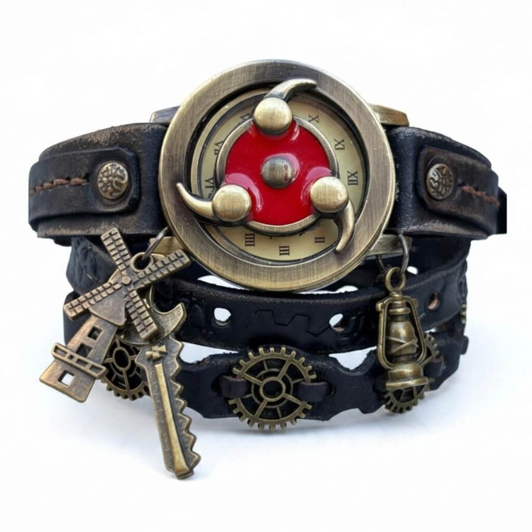 Front view of one-of-a-kind steampunk leather wrap watch featuring a 36mm brass-tone case, red decorative face cover, layered dark leather, gears, and hanging industrial charms.