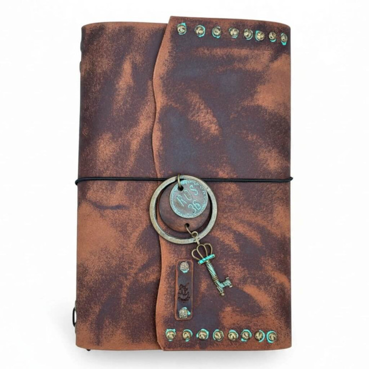 Handmade distressed brown A5 leather journal with curved wrap flap, black elastic closure, antique brass studs, and vintage key charm.
