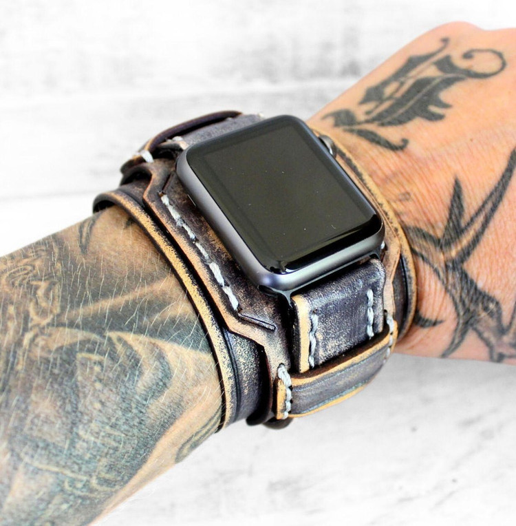 Handmade distressed gray leather Apple Watch cuff band worn on wrist – wide full-grain strap for men, rugged artisan style. Handmade distressed gray leather Apple Watch cuff band worn on wrist – wide full-grain strap for men, rugged artisan style.