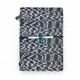 Black and white snakeskin-patterned A5 leather journal with turquoise-colored bead and decorative elastic closure.