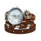 Women's brown leather wrap watch with patterned straps, silver-tone flower charm, and blue-gray analog watch face.