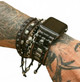 Distressed black skull leather Apple Watch band worn with stacked leather and beaded bracelets