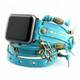 Turquoise leather Apple Watch wrap band with octopus charm, antique brass details, white stitching, and layered straps.