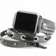 Close-up of gray leather Apple Watch wrap strap showing silver eyelets, black leather lacing, and an adjustable buckle design.