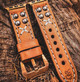 Cool, handmade brown leather Apple Watch band with rivets and gray stitching.