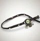 Women's leather watch in distressed dark brown with triple wrap design, silver beads and vintage charms, laid flat on white background